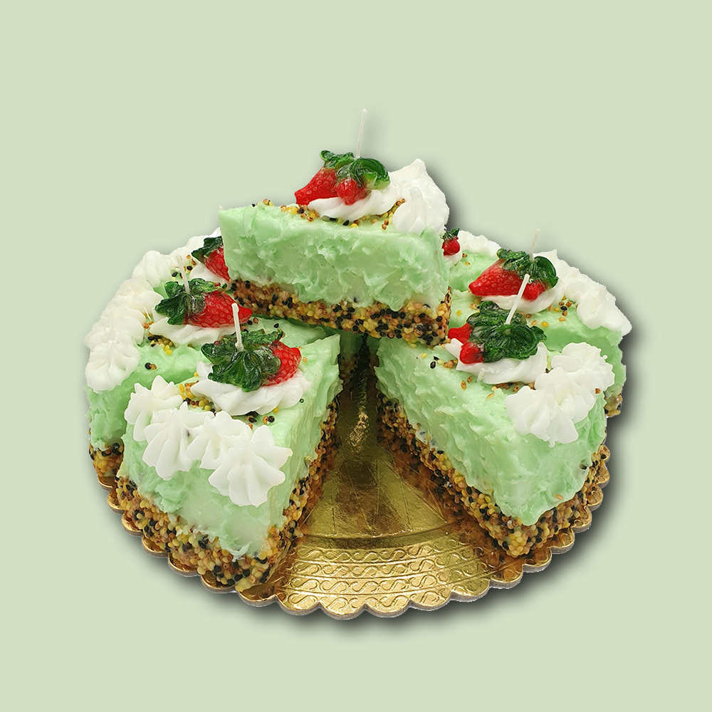 Eine Kerze in Form einer Knuspertorte im Farbton grün von Cereria Introna