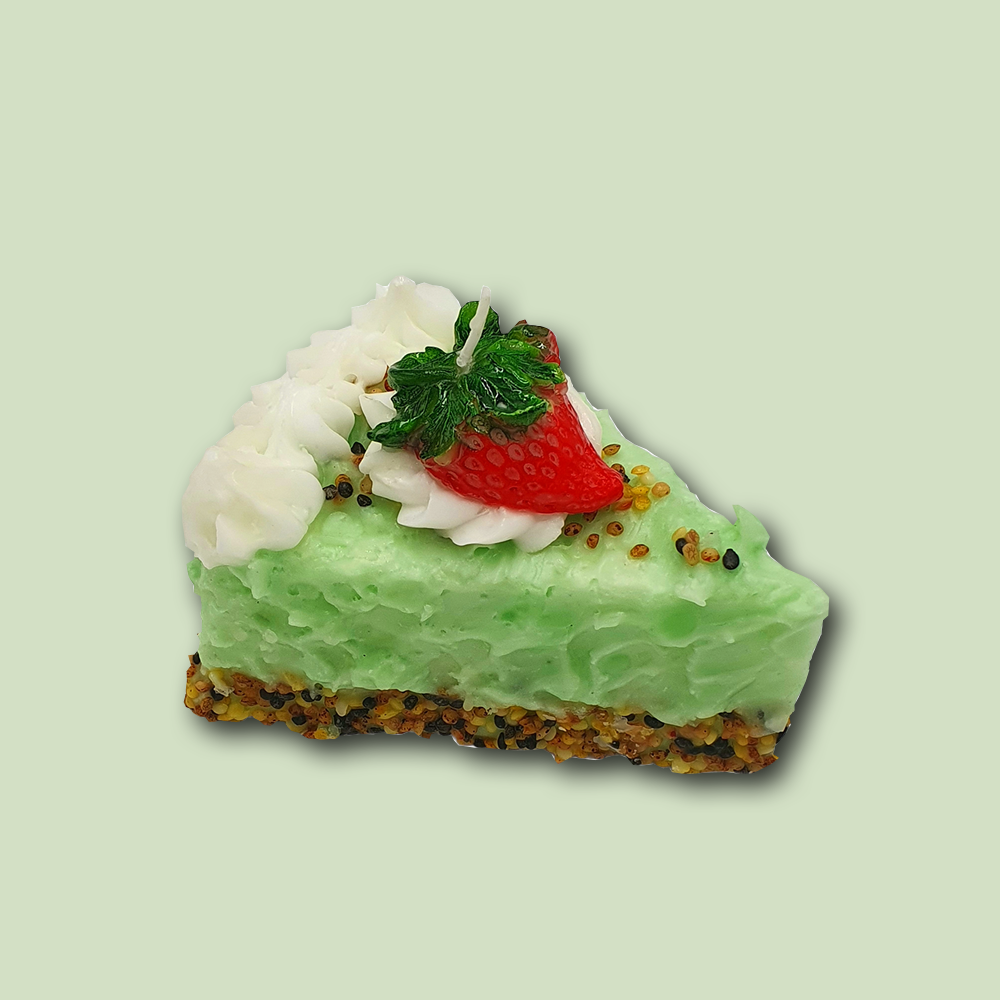 Eine Kerze in Form einer Knuspertorte im Farbton grün von Cereria Introna
