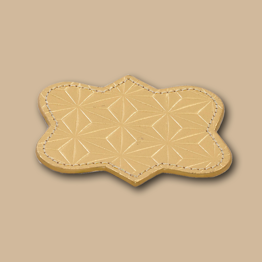 Handgemachter Untersetzer aus Leder in gold